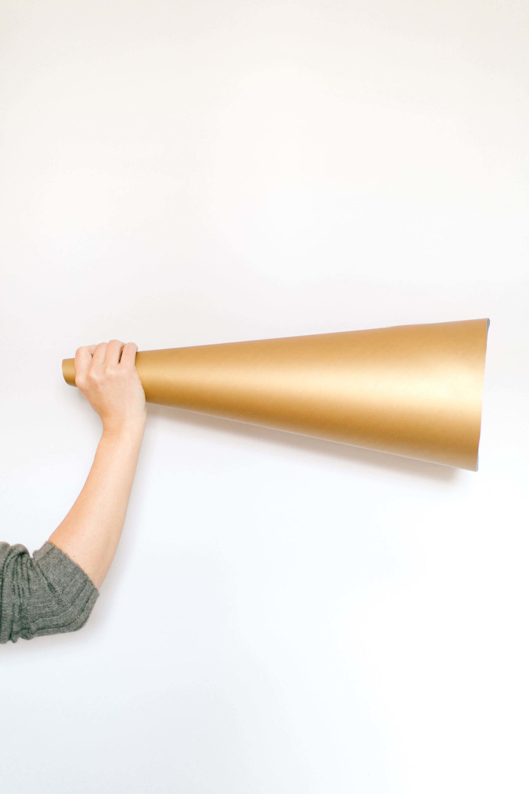 A gold bullhorn: the most important thing you can do for your new business.
